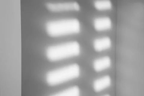 Light and shadows falling on white wall 스톡 사진