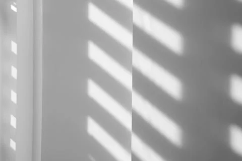 Light and shadows falling on white wall 스톡 사진