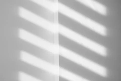 Light and shadows falling on white wall 스톡 사진