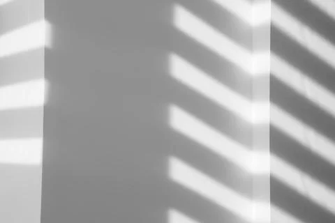 Light and shadows falling on white wall 스톡 사진