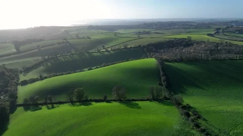 Light and Shadows over Fields and Farms from a drone, Torquay, Devon, UK 動画素材 222587614