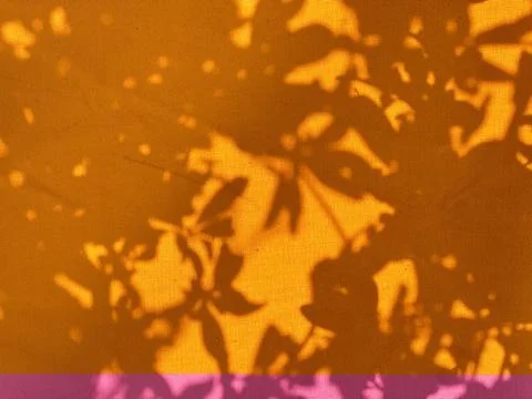 Light and shadowy sunset on orange fabric Stock Photos