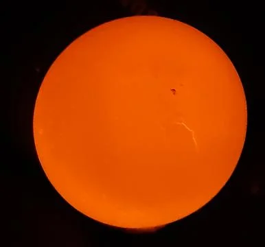 The light is on the back of the egg and the egg is bright yellow. Stock Photos
