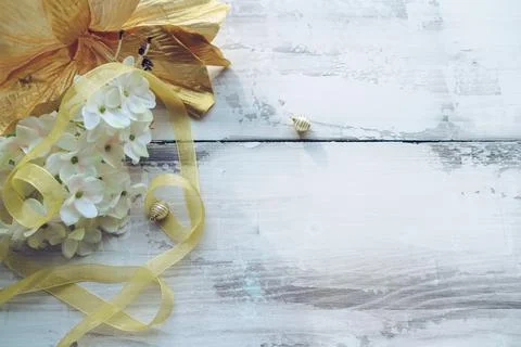 Light background of blooming white hydrangea and golden lily flowers with  ri Stock Photos