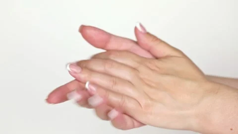 On a light background female hands smear cream Stock Footage 196372217