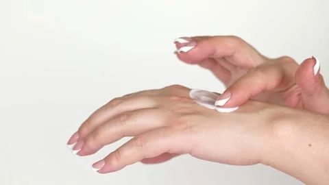 On a light background, hands smear cream Stock Footage 196371984