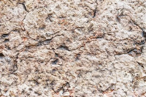 Light background from natural limestone. Texture of natural stone with cracks 스톡 사진