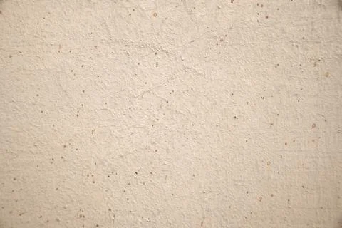 Light background of plaster of house with small dots. Stock Photos