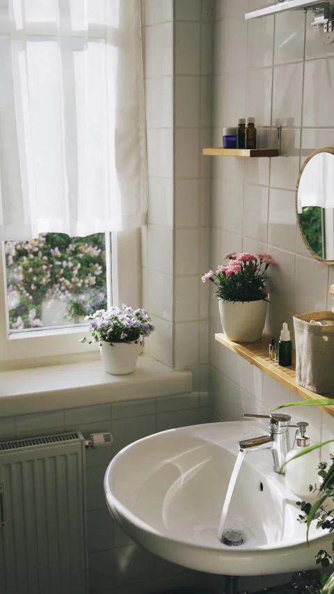 Light bathroom with big window in the evening sunlight Stock Footage 243521426