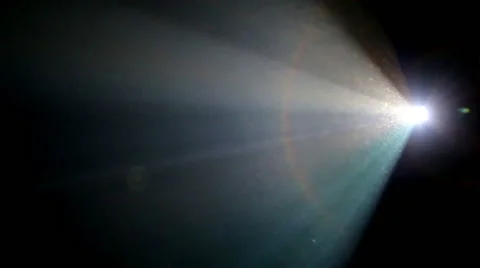 Light beam of a 35mm projector running in a darkened movie theater Stock Footage