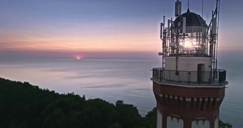 Light beam from lighthouse at Baltic Sea during sunset. Stock Footage 294840537