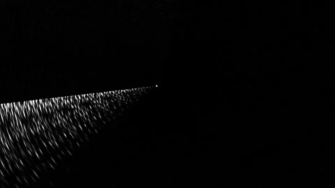 Light beam moving through dark space with scattered Stock Footage 339369956