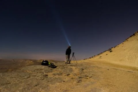 Light beam into the night desert Stock Photos