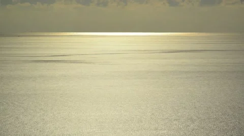 Light beam shining through the cloudscape over the sea Stock Footage 45029413