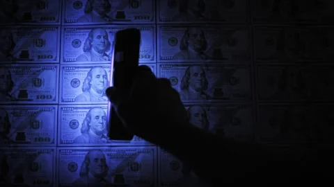 Light Beam Sweeping Across Grid Of Hundred Dollar Bills Stock Footage 329909852