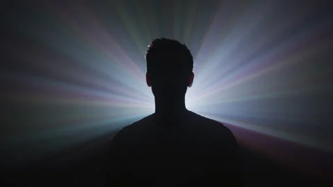 Light beams behind a silhouette Stock Footage 216500660