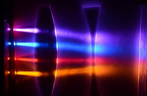 Light beams pass trough a concave and a convex lens Stock Photos