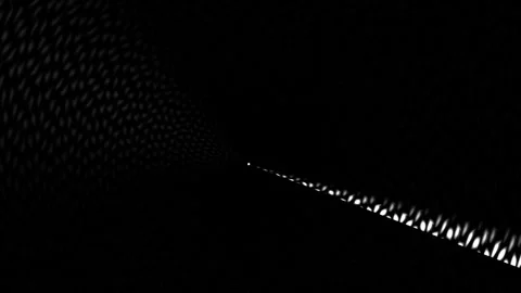 Light beams shine through a dark tunnel with a gradual fade Stock Footage 339359514
