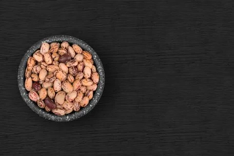 Light beans inside a rustic bowl 스톡 사진
