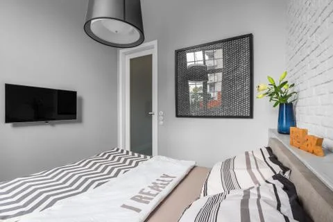 Light bedroom with double bed Stock Photos