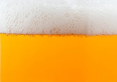 Light beer background with foam 写真素材