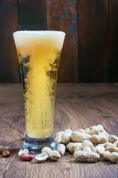 Light beer with peanuts Stock Photos