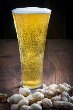 Light beer with peanuts Stock Photos