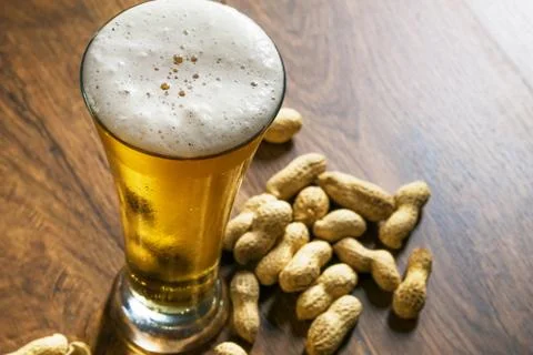 Light beer with peanuts Stock Photos