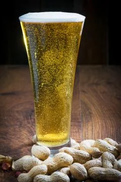 Light beer with peanuts Stock Photos