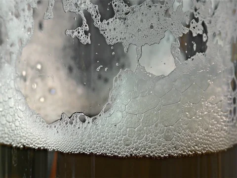 Light beer is poured in a glass Stock Footage 77568541