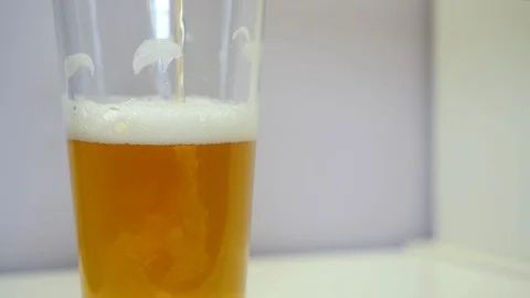 Light beer poured into a glass. Stock Footage 127578043