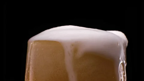 Light beer pouring in glass. With bubbles and foam. Cold and refreshing beer. Stock Footage 153665867