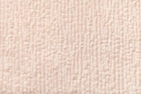 Light beige fluffy background of soft, fleecy cloth. Texture of textile close Stock Photos