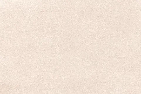 Light beige matte background of suede fabric, closeup. Velvet texture of text Stock Photos