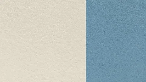 Light beige paper texture background with muted blue vertical split and cop.. Foto stock