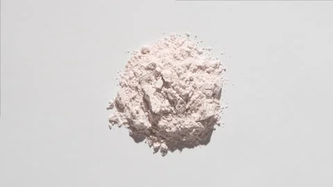 Light beige powder stack on light gray background Stock Footage 342562838