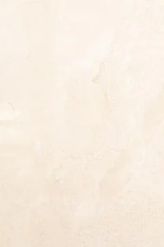 Light beige textured surface showcasing subtle patterns and variations Foto stock