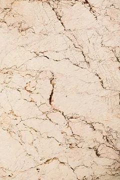 Light beige travertine stone texture with cracks and natural lines Stock Photos