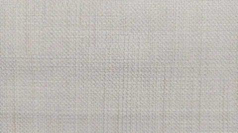  Light beige woven fabric texture with fine grid pattern and soft cream c.. Stock Photos