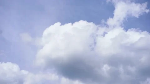 Light big white clouds fly across at blue sky. Clear sky at sunny afternoon Stock Footage 182376184
