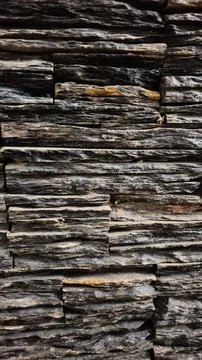 Light black colored abstract brick wall texture background Stock Photos