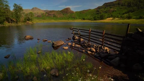 Light on blea tarn and the langdales Stock Footage 346920950