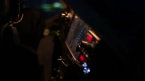 Light blinking on flight control panel at aircraft cockpit, pilot flying plane Stock Footage 63927581