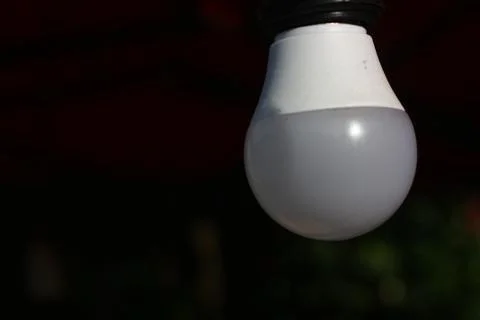 Light blub on dark background Stock Photos