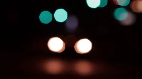 Light blue and warm white bokeh with moving headlights Stock Footage 83800255