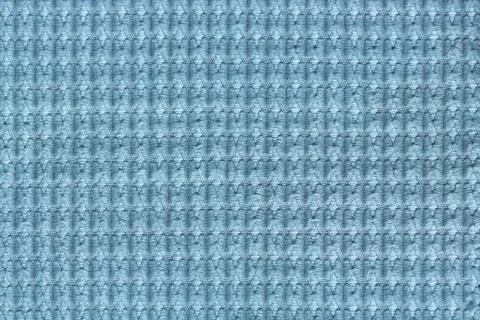 Light blue background from soft fleecy fabric close up. Texture of textiles m Stock Photos