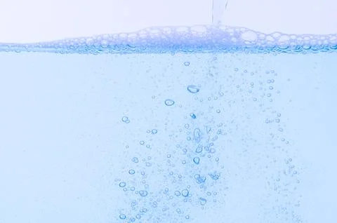 Light blue bubbles and water White background Foto stock