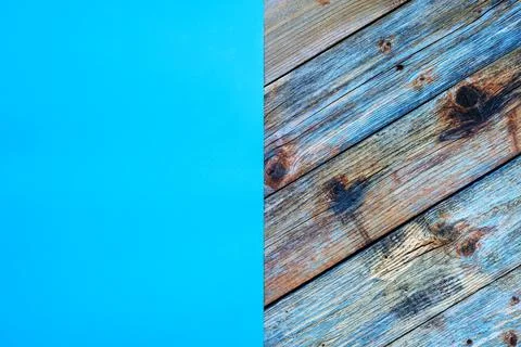 Light blue cardstock on a rustic table constructed from aged wooden planks. A Stock Photos