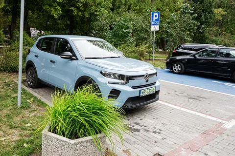 Light blue Citron e-C3 compact car parked in a marked parking bay with disa.. Stock Photos