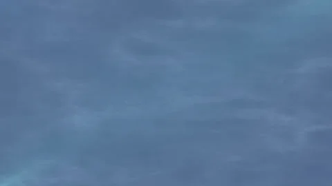 A light blue, cloudy sky with a soft texture and the MicrostockPlus logo Stock Footage 282907338